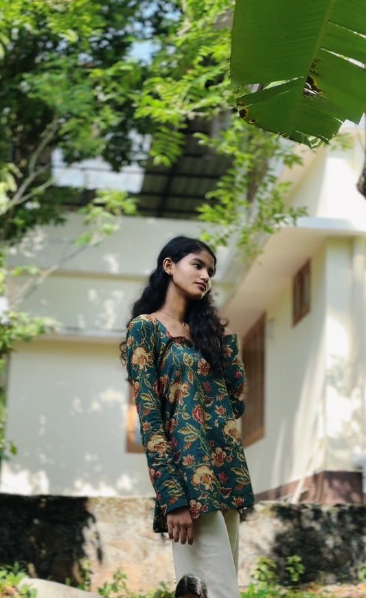 All-over floral print featuring traditional, intricate flower and leaf motifs.