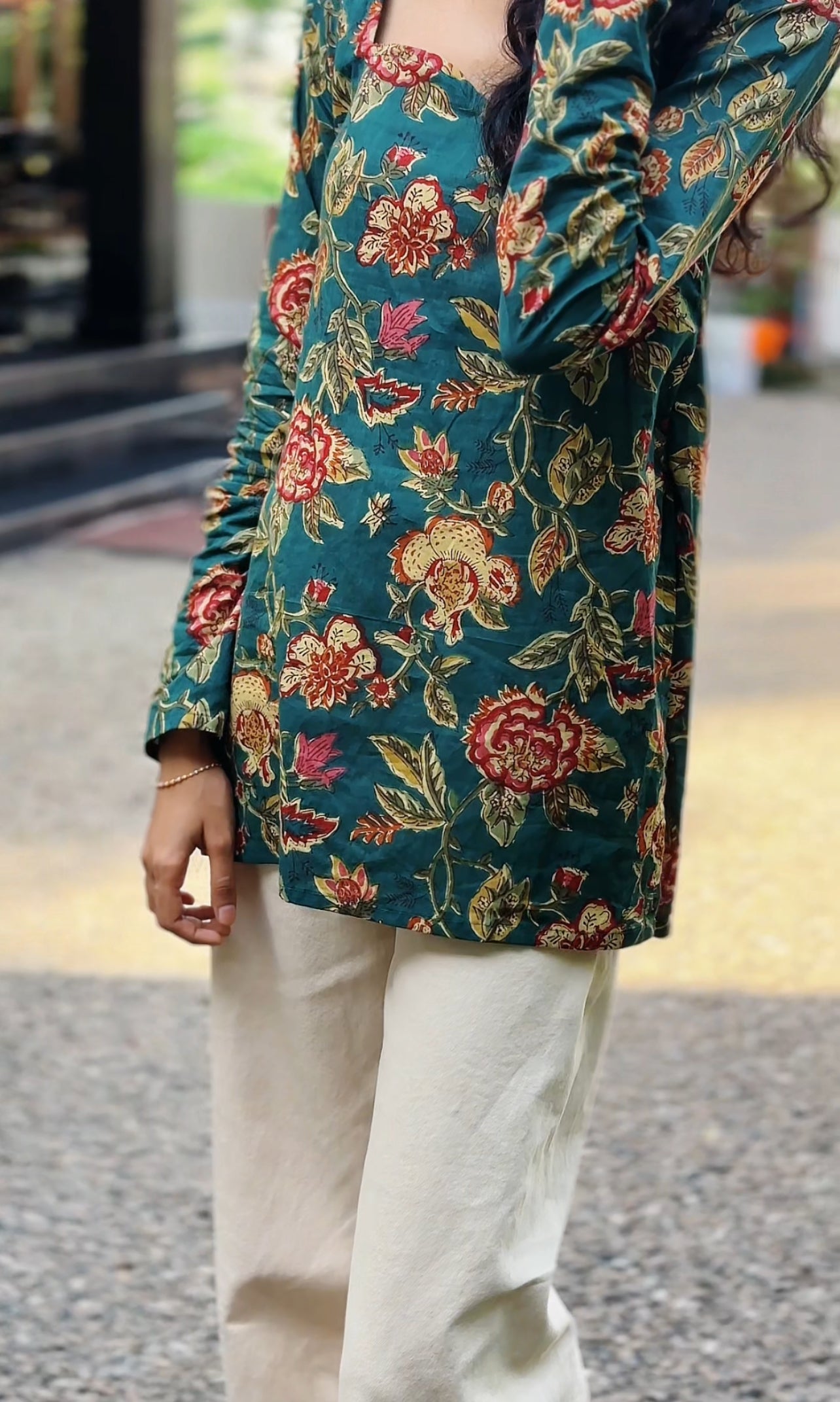All-over floral print featuring traditional, intricate flower and leaf motifs.